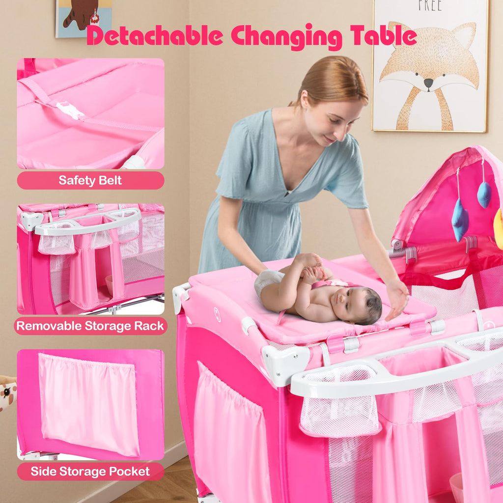 4 in 1 Pack and Play Portable Baby Bassinet Playpen with Diaper Changer Mattress Canopy Storage Rack Toy Bar Music Box Foldable Travel Playard Pink W5586